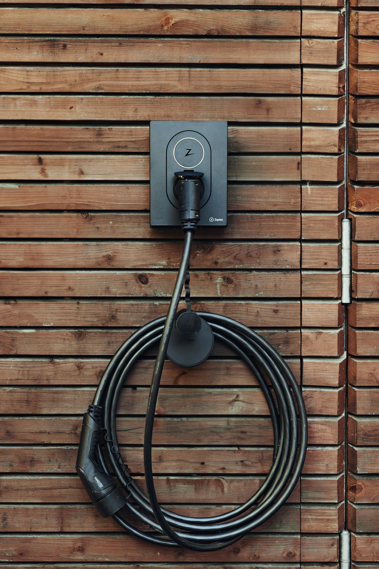 A home EV charger mounted on a wall